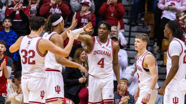 Indiana Hoosiers forward Anthony Walker (4) celebrates a basket and foul with teammates in the second half against the Morehead State Eagles at Simon Skjodt Assembly Hall.